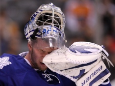 Toronto Maple Leafs goaltender James Reimer wipes his face after being scored on by the Philadelphia Flyers in an NHL game in Toronto on Thursday, March 10, 2011. Math is not on the Leafs' side. Neither is time. (THE CANADIAN PRESS/Frank Gunn)