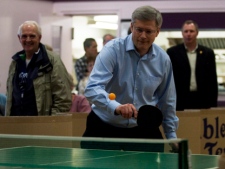 Prime Minister Stephen Harper plays table tennis during a campaign stop at a seniors home in Colwood, B.C., on Monday March 28, 2011. (THE CANADIAN PRESS/Adrian Wyld)