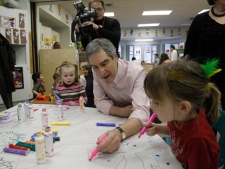 Liberal Leader Michael Ignatieff draws with a child during a campaign stop at Lord Roberts Preschool in Winnipeg on Thursday, March 31, 2011. (THE CANADIAN PRESS/Ryan Remiorz)
