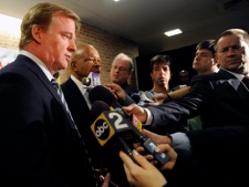 NFL Commissioner Roger Goodell , left, and Congressman Elijah Cummings, D-Md., talks with reporters after an assembly about the dangers of steroid use Monday, April 4, 2011 at Woodlawn High School in Woodlawn, Md. Commissioner Roger Goodell says the NFL will insist that its next labor deal with players includes testing for human growth hormone.(AP Photo/Gail Burton) 