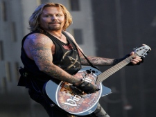 In this Aug. 5, 2010 file photo, singer Vince Neil performs at the Wacken Open Air Festival in Wacken, Schleswig Holstein, northern Germany. A criminal complaint filed Tuesday, April 5, 2011, accuses the 50-year-old Neil of poking his finger into the chest of ex-girlfriend Alicia Jacobs in a casino lounge late March 24. (AP Photo/Axel Heimken)