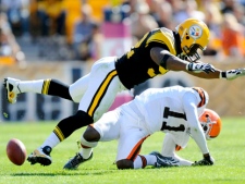 In this Oct. 17, 2010, file photo, Pittsburgh Steelers linebacker James Harrison) hits Cleveland Browns wide receiver Mohamed Massaquoi during the second quarter of a an NFL football game in Pittsburgh. (AP Photo/Don Wright, File)