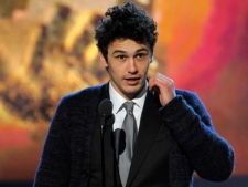 James Franco accepts the award for best male lead for "127 Hours" at the Independent Spirit Awards on Saturday, Feb. 26, 2011, in Santa Monica, Calif. (AP Photo/Chris Pizzello)