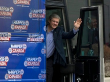 Prime Minister Stephen Harper boards his campaign bus in Richmond Ont., on Thursday, April 7, 2011. (THE CANADIAN PRESS/Sean Kilpatrick)