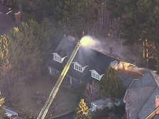 This screen grab shows fire crews at the scene of a house fire on Shawanaga Trail in Mississauga on Tuesday, April 12, 2011.