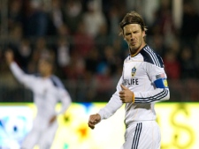 Los Angeles Galaxy's David Beckham gestures to teammate Chad Barrett, not shown, after an attempt on Toronto FC's goal during first half MLS action in Toronto on Wednesday April 13, 2011. (THE CANADIAN PRESS/Chris Young)