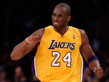 Los Angeles Lakers' Kobe Bryant celebrates after making a three-point basket against the San Antonio Spurs during the second half of an NBA basketball game in Los Angeles, Tuesday, April 12, 2011. (AP Photo/Chris Carlson)