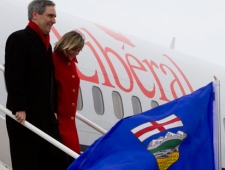 Liberal leader Michael Ignatieff and his wife Zsuzsanna Zsohar get off their campaign plane in Edmonton on Saturday, April 16, 2011.  THE CANADIAN PRESS/Jonathan Hayward