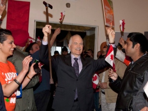 NDP Leader Jack Layton raises his arms as he enters a rally Thursday, April 21, 2011 in Brampton Ont. (THE CANADIAN PRESS/Jacques Boissinot)