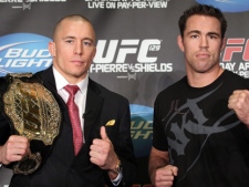 UFC 129 fighters Georges St-Pierre (left) and Jake Shields pose at a news conference in Toronto on Tuesday February 8, 2011. (THE CANADIAN PRESS/Frank Gunn)
