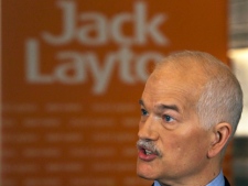 NDP Leader Jack Layton talks with reporters during a campaign stop in Montreal on Tuesday, April 26, 2011. The federal election will be held on May 2. (THE CANADIAN PRESS/Andrew Vaughan)