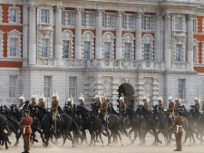 Soldiers of the Household Cavalry cross Horseguards as they take part in an overnight dress rehearsal for the Royal Wedding of Britain's Prince William and Kate Middleton, in central London, Wednesday, April, 27, 2011. Prince William is to marry Kate Middleton at Westminster Abbey in London, on Friday, April 29. (AP Photo/Alastair Grant)