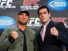 Fighters Randy Couture, left, and Lyoto Machida, right, poses for a photograph during a UFC press conference in Toronto on Wednesday, April 27, 2011. Toronto will hold the largest venue in UFC history selling out with 55,000 fans at the Rogers Centre this coming Saturday. (THE CANADIAN PRESS/Nathan Denette)