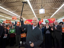 NDP Leader Jack Layton waves to supporters during a campaign stop at the Indian and Metis Friendship Centre in Winnipeg on Wednesday, April 27, 2011. The federal election will be held on May 2. (THE CANADIAN PRESS/Andrew Vaughan)