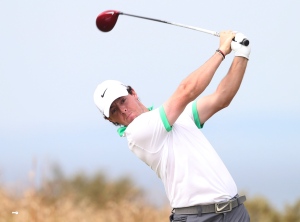 Johnson seizes early lead on calm day British Open