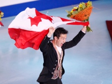 Gold medalist Canada's Patrick Chan skates with the national flag after free program at the ISU Figure Skating World championships in Moscow, Russia, Thursday, April 28, 2011. (AP Photo/Misha Japaridze)