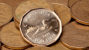 Loonies are pictured. (Jonathan Hayward / THE CANADIAN PRESS)