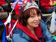 Cathy Andrew from Toronto, Canada, waits outside Buckingham Palace, London, on the day of the royal wedding of Britain's Prince William to his fiancee Kate Middleton, Friday April 29, 2011. (AP Photo/Rui Vieira/PA)