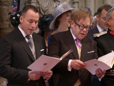 In this image taken from video, British singer Elton John, right, and his partner David Furnish sing during the ceremony at Westminster Abbey for the Royal Wedding in London on Friday, April, 29, 2011. (AP Photo/APTN) 