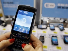 In this March 22, 2011 photo, a customer uses a Research In Motion Blackberry Torch. (AP Photo/Paul Sakuma)