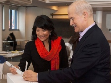 NDP Leader Jack Layton and his wife Olivia Chow casts their ballots at a voting station in Toronto on Monday, May 2, 2011. (THE CANADIAN PRESS/Andrew Vaughan)