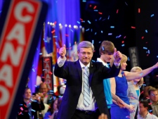 Prime Minister Stephen Harper, his wife Laureen, son Ben and daughter Rachel wave to party faithful following Harper's first majority win in Calgary, Alta., Monday May 2, 2011. Canadians voted in the fourth federal election in eight years. (THE CANADIAN PRESS/Jeff McIntosh)