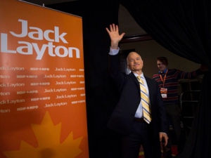 Jack Layton, left, NDP leader and now officially the leader of the opposition, waves to the media after a press conference in Toronto on Tuesday, May 3, 2011. (THE CANADIAN PRESS/Nathan Denette)