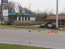 The aftermath of a single-vehicle collision that killed two people in Orillia, Ont., early Tuesday, May 3, 2011. 