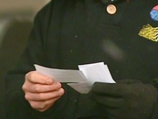 A man holds tickets to an event in this file photo.