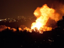 A massive ball of fire at the scene of a blaze that destroyed one house and damaged others on St. Clements Avenue early Thursday, May 5, 2011. (MyBreakingNews/Rodrigo Fernandez)