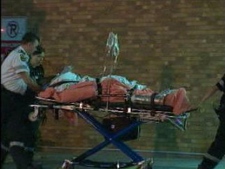 Paramedics wheel an injured man into Sunnybrook Hospital after a shooting on Willowdale Avenue on Thursday, May 5, 2011.
