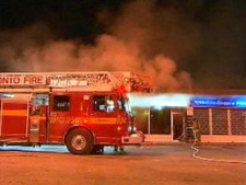 Firefighters at the scene of a restaurant fire on Sheppard Avenue near Pharmacy Avenue on Monday, May 9, 2011.