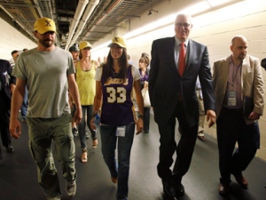 Los Angeles Lakers coach Phil Jackson, second from right, walks down a tunnel with members of his family after the Dallas Mavericks' 122-86 win in Game 4 of a second-round NBA playoff basketball series, Sunday, May 8, 2011, in Dallas. The Mavericks swept the series. (AP Photo/Tony Gutierrez)