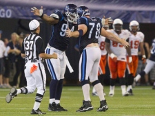 Toronto Argonauts Kevin Huntley, left, and Adriano Belli celebrate a late fourth quarter touchdown during CFL action agaist the B.C. Lions in Toronto Friday, July 23, 2010. (THE CANADIAN PRESS/Darren Calabrese)