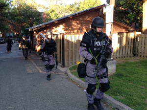 Police attend the scene of a shooting near The Queensway and Windermere Avenue Monday August 5, 2013. (Cristina Tenaglia /CP24)
