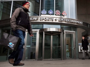Pedestrians walk past the Maple Leaf Sports + Entertainment office in Toronto Sunday, March 13, 2011. (THE CANADIAN PRESS/Darren Calabrese)