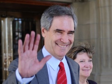 Outgoing Liberal Leader Michael Ignatieff leaves the Centre Block of Parliament Hill with his wife Zsuzsanna Zsohar following a Liberal caucus meeting on Parliament Hill in Ottawa on Wednesday, May 11, 2011. (THE CANADIAN PRESS/Sean Kilpatrick)