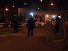 Toronto police and paramedics at the scene of a shooting near Jane and Finch on Tuesday, May 10, 2011.