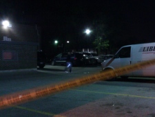 Police tape at the scene of a shooting on Martin Grove Road near Albion Road on Wednesday, May 11, 2011.