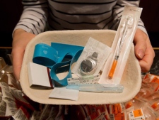 Registered nurse Sammy Mullally holds a tray of supplies to be used by a drug addict at the Insite safe injection clinic in Vancouver, B.C., on Wednesday May 11, 2011. Insite, North America's first and only legal injection site, promoted by its founders as a safe, humane facility for drug abusers, is now facing a court challenge from the Conservative government that sees it as a facilitator of drug abuse. The case opens before the Supreme Court of Canada in Ottawa on Thursday, May 12, 2011 and has drawn international attention. THE CANADIAN PRESS/Darryl Dyck