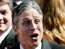In a file photo Jon Stewart, host of the Emmy-nominated show "The Daily Show with Jon Stewart," arrives for the 58th Annual Primetime Emmy Awards Sunday, Aug. 27, 2006. (AP Photo/Amy Sancetta)