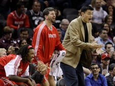 Houston Rockets' Yao Ming, front right, of China, and teammates react during the fourth quarter of an NBA basketball game against the San Antonio Spurs, Saturday, Nov. 6, 2010, in San Antonio. (AP Photo/Eric Gay)