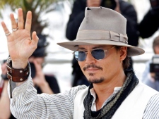 Actor Johnny Depp poses during a photo call for Pirates of the Caribbean: On Stranger Tides at the 64th international film festival, in Cannes, southern France, Saturday, May 14, 2011. (AP Photo/Joel Ryan)