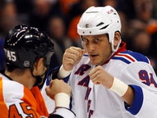 In this Nov. 4, 2010, file photo, Philadelphia Flyers' Jody Shelley, left, and New York Rangers' Derek Boogaard fight during an NHL hockey game in Philadelphia. Boogaard, at age 28, died on Friday. Boogaard signed with the Rangers as a free agent in July,2010 appearing in 22 games last season, registering one goal and one assist. (AP Photo/Matt Slocum, File)