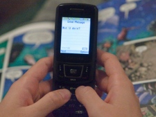 A text message is sent on a mobile phone. (THE CANADIAN PRESS/Ryan Remiorz)