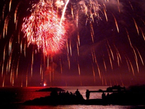 People line the shore of Lake Ontario at Ashbridge's Bay in Toronto to watch fireworks for the Victoria Day holiday in this Monday, May 22, 2000, photo. (CP PHOTO/Frank Gunn)