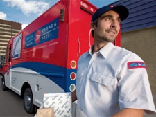 A Canada Post employee is seen in this image made available to media by Canada Post.