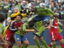 Toronto goalie Stefan Frei comes out of goal to deny a shot by Seattle's Jhon Kennedy Hurtado in the first half as Sounders FC take on Toronto FC on Saturday, April 30, 2011 at Qwest Field in Seattle, Wash. (AP PHOTO/The Seattle Times, Dean Rutz) 