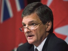 Attorney General Chris Bentley speaks during a press conference on Oct. 1, 2008 in Toronto. THE CANADIAN PRESS/ Nathan Denette)
