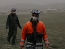Farmers check on their animals near Kirkjubaearklaustur 260 km (162 miles) from Reykjav�k, Iceland Tuesday May 24 2011 after the Grimsvotn volcano began erupting on Saturday, sending clouds of ash high into the air that have then been carried toward the European continent on the wind. Experts say that particles in the ash could stall jet engines and sandblast planes' windows. The ash cloud forced US President Barack Obama to shorten a visit to Ireland on Monday, and has raised fears of a repeat of huge travel disruptions in Europe last year when emissions from another of Iceland's volcanos, Eyjafjalljokull, stranded millions of passengers.(AP Photo/Brynjar Gauti )